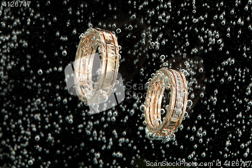 Image of Golden Rings In The Water