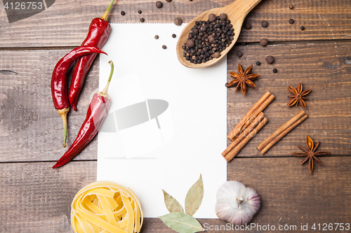 Image of blank paper with pasta, pepper and spices