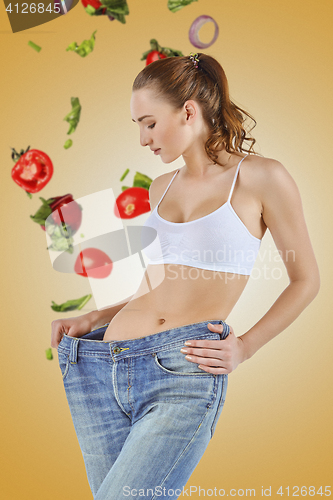 Image of Woman became skinny and wearing old jeans