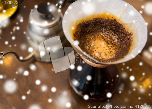 Image of close up of coffeemaker and coffee pot