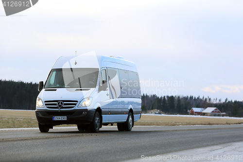 Image of White Mercedes-Benz Sprinter Minibus on the Road