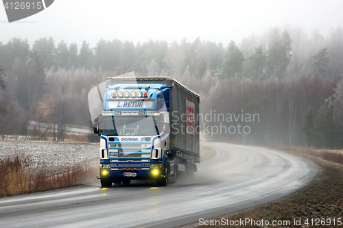 Image of Scania 164L Semi Trucking on Foggy Winter Highway