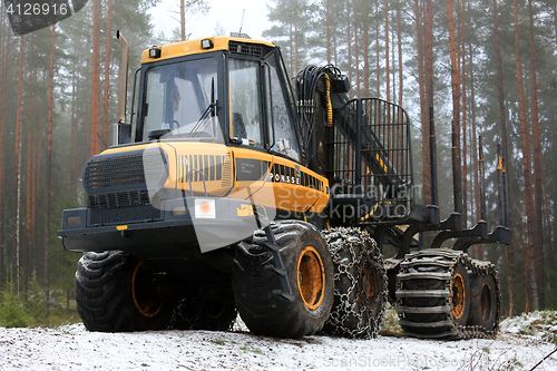 Image of PONSSE Elk Forwarder in Foggy Winter Forest