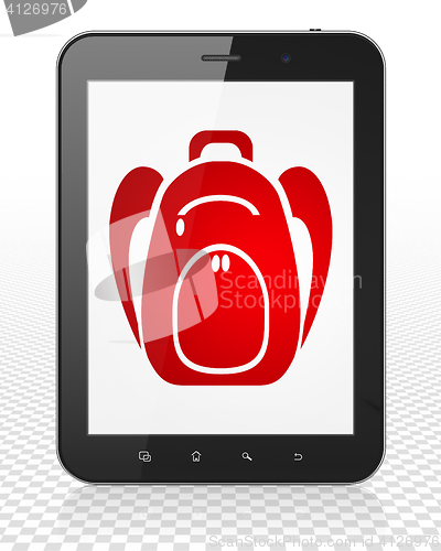 Image of Studying concept: Tablet Pc Computer with Backpack on display