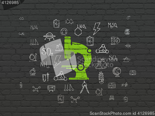 Image of Science concept: Microscope on wall background