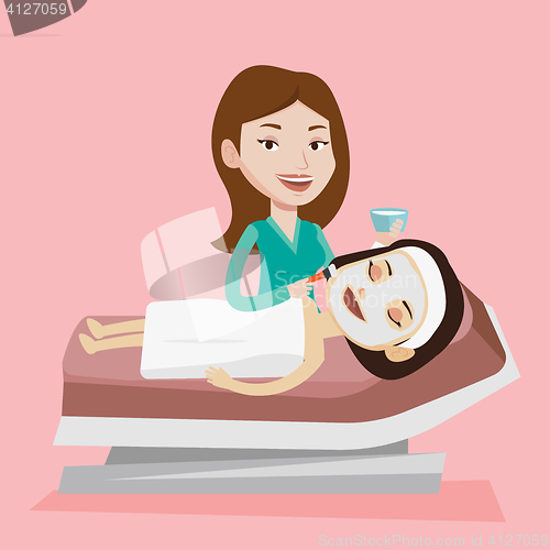 Image of Woman in beauty salon during cosmetology procedure