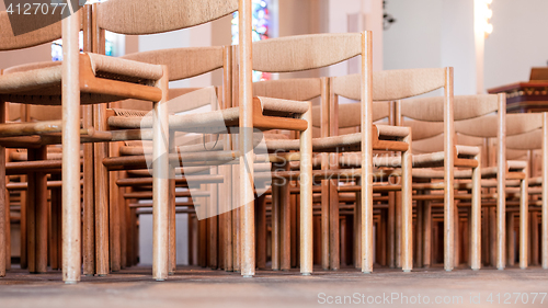Image of Rows of seats inside church, selective focus