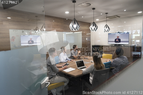 Image of start up business people group attending videoconference call