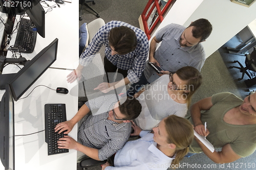 Image of startup business people group working as team to find solution