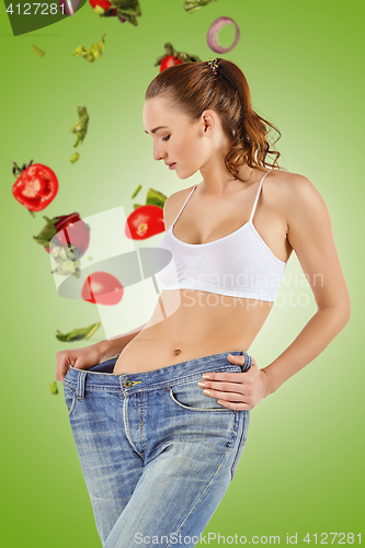 Image of Woman became skinny and wearing old jeans