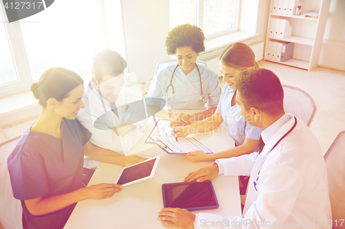 Image of group of happy doctors meeting at hospital office