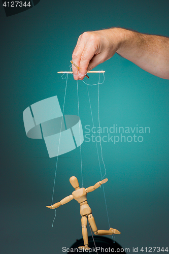 Image of Image puppet in the hands of the puppeteer