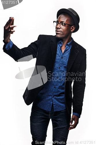 Image of The black man with happy expression with phone