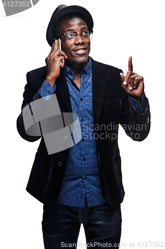 Image of The black man with happy expression with phone