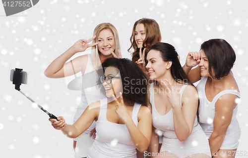 Image of group of happy women taking selfie by smartphoone