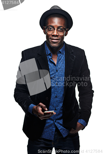 Image of The black man with happy expression with phone