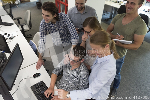 Image of startup business people group working as team to find solution