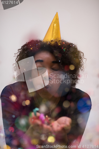 Image of happy young woman celebrating