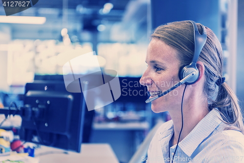 Image of female support phone operator