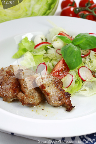 Image of Pork steak with vegetable salad