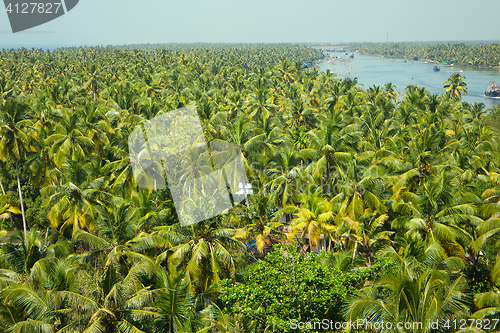 Image of tropical river with trawlers in Southeast Asia