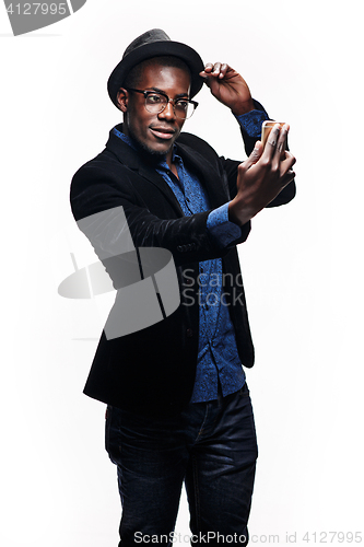 Image of The black man with happy expression with phone