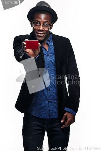 Image of The black man with happy expression with credit card