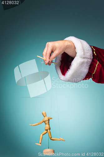 Image of Image puppet in the hands of Santa