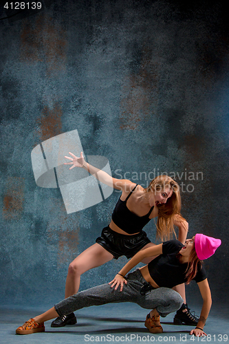 Image of The two attractive girls dancing twerk in the studio