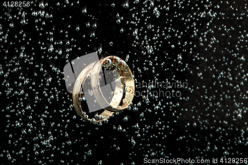 Image of Golden Rings In The Water