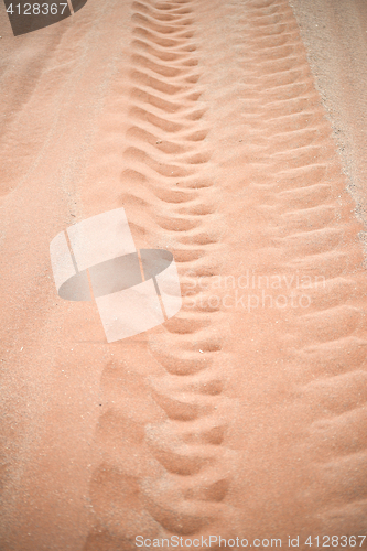 Image of wheel track on sand