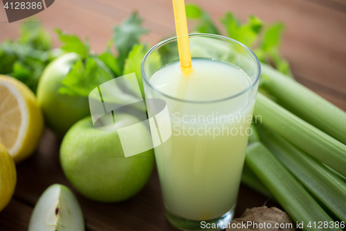 Image of close up of glass with green juice and vegetables