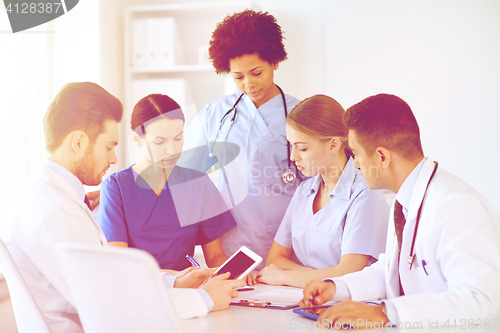 Image of group of doctors with tablet pc at hospital