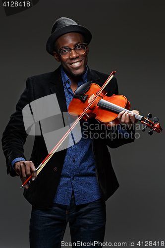 Image of The black man happy expression and music instrument