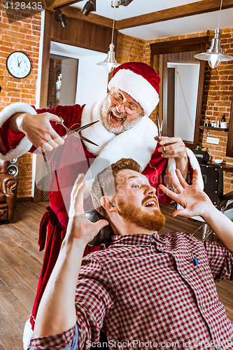 Image of Santa claus as master at barber shop