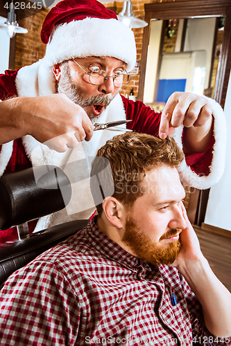 Image of Santa claus as master at barber shop