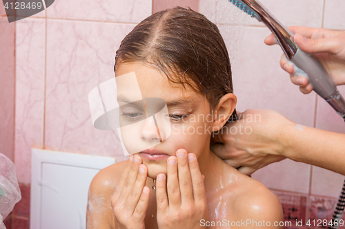 Image of The girl thought until my mother washes her long hair