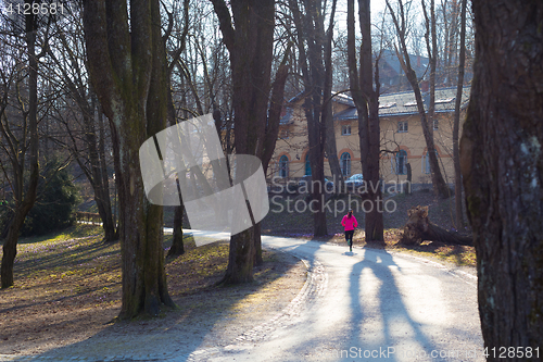 Image of Female runner in the forest. 