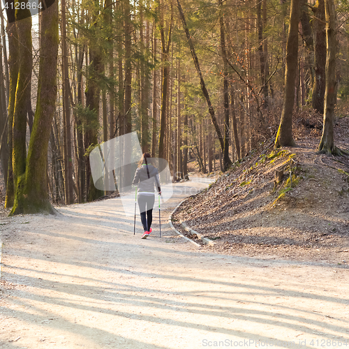 Image of Woman hiking in nature. 