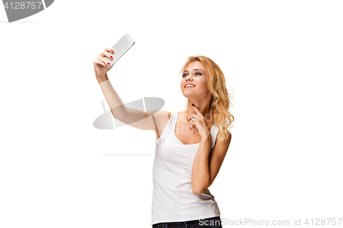 Image of Portrait of beautiful smiling girl with modern l phone