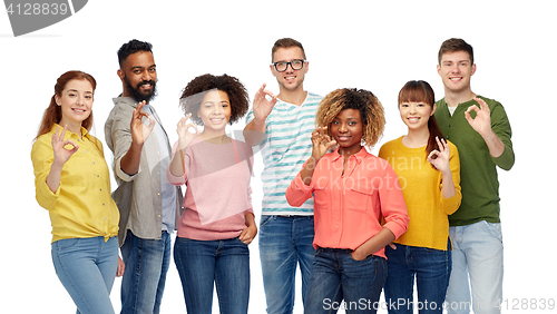 Image of international group of happy people showing ok