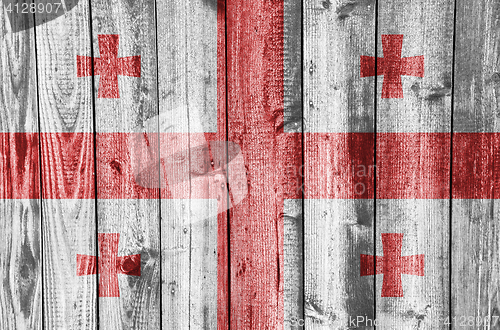 Image of Flag of Georgia on weathered wood