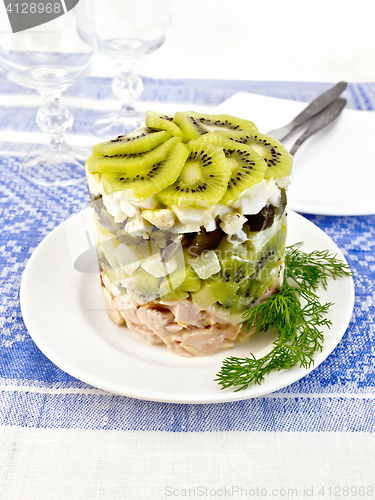 Image of Salad of chicken and kiwi on tablecloth