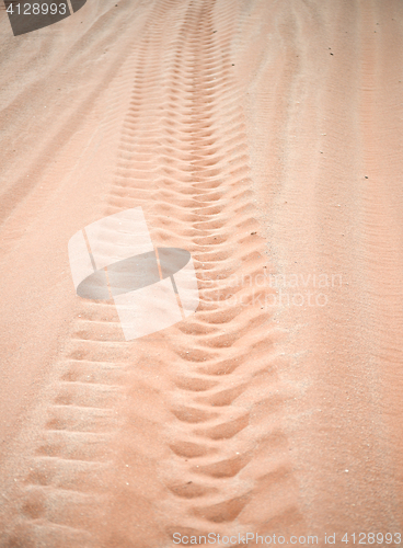 Image of wheel track on sand