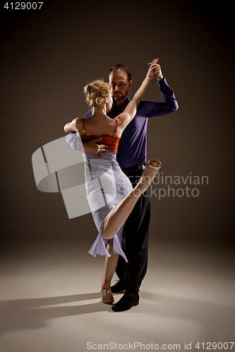 Image of The man and the woman dancing argentinian tango