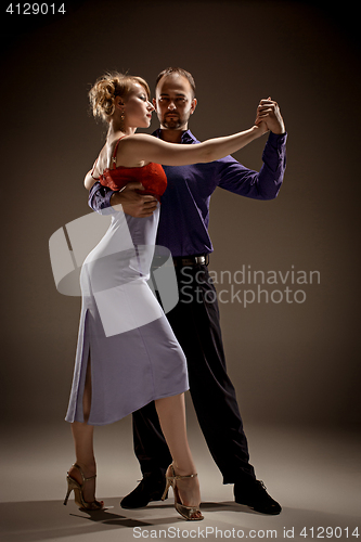 Image of The man and the woman dancing argentinian tango