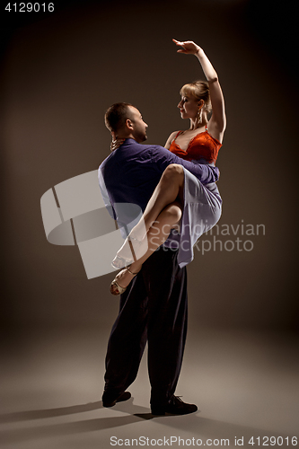 Image of The man and the woman dancing argentinian tango