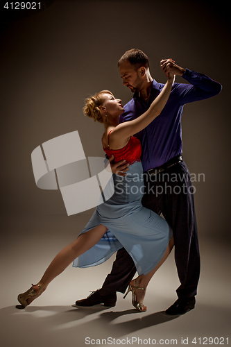 Image of The man and the woman dancing argentinian tango