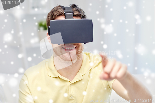 Image of young man in virtual reality headset or 3d glasses