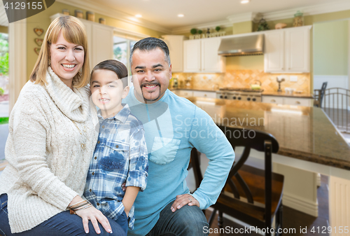 Image of Mixed Race Young Family Inside Kitchen of House